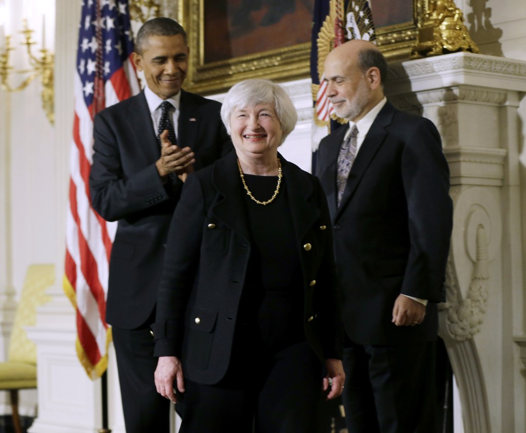 President Barack Obama applauds as he walks out the State Dining Room of the White House in Washington, Wednesday, Oct. 9, 2013, with outgoing Federal Reserve Chairman Ben Bernanke, right, and Janet Yellen, center, his nominee to replace Bernanke.
