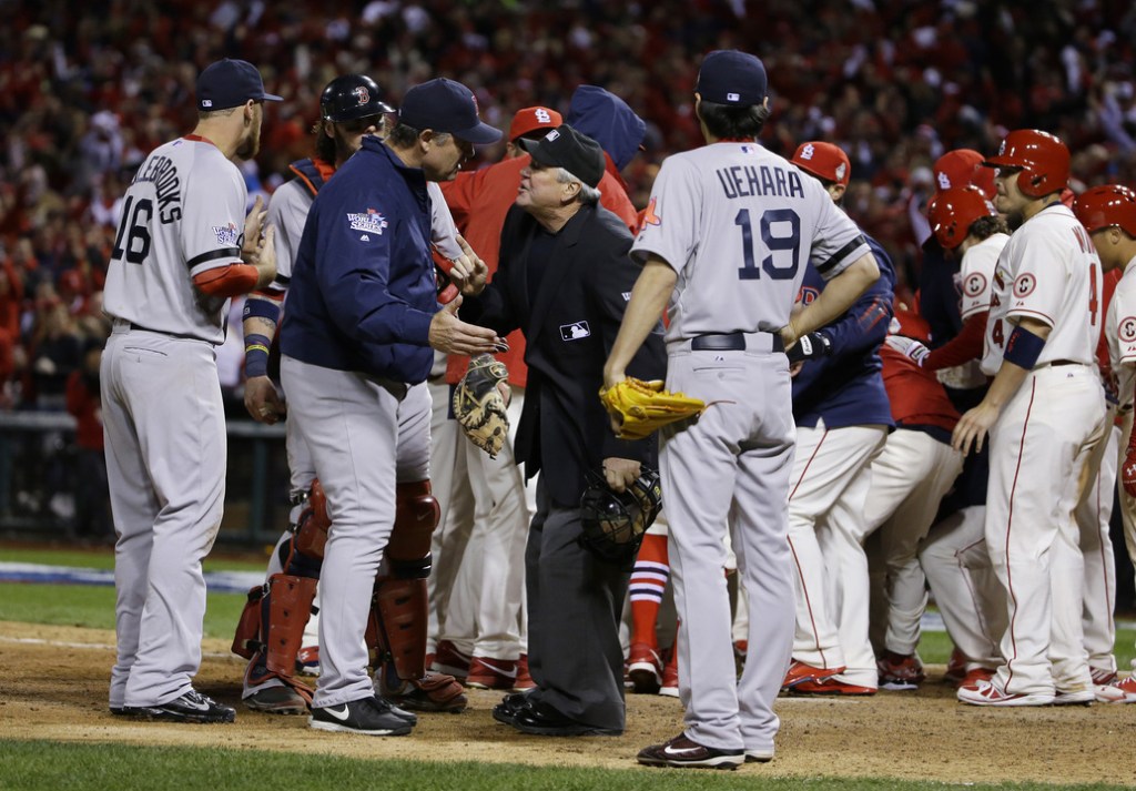 Boston Red Sox manager John Farrell argues with home plate umpire Dana DeMuth after St. Louis Cardinals scored the winning run on an obstruction play during the ninth inning of Game 3 of baseball's World Series Saturday, Oct. 26, 2013, in St. Louis. The Cardinals won 5-4 to take a 2-1 lead in the series. (AP Photo/Matt Slocum)