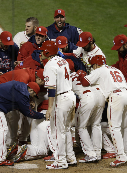 The St. Louis Cardinals were celebrating just as the Boston Red Sox started arguing Saturday night. Allen Craig is at the bottom of the pile after scoring when an obstruction call was made, giving St. Louis a 5-4 victory in the game and a 2-1 lead in the World Series. The teams will play Game 4 on Sunday night.