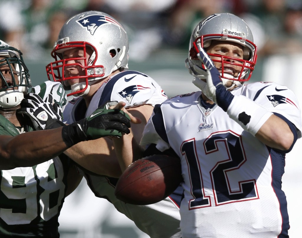 Tom Brady had a rough go of it in Sunday’s loss to the Jets, such as when linebacker Quinton Coples overcame a block and knocked the ball away from the New England quarterback.
