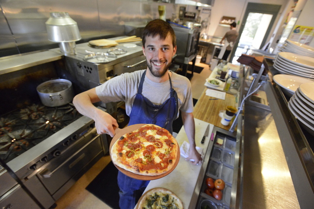Chef Chad Conley displays a pepperoni with pickled chiles pizza at Gather in Yarmouth.