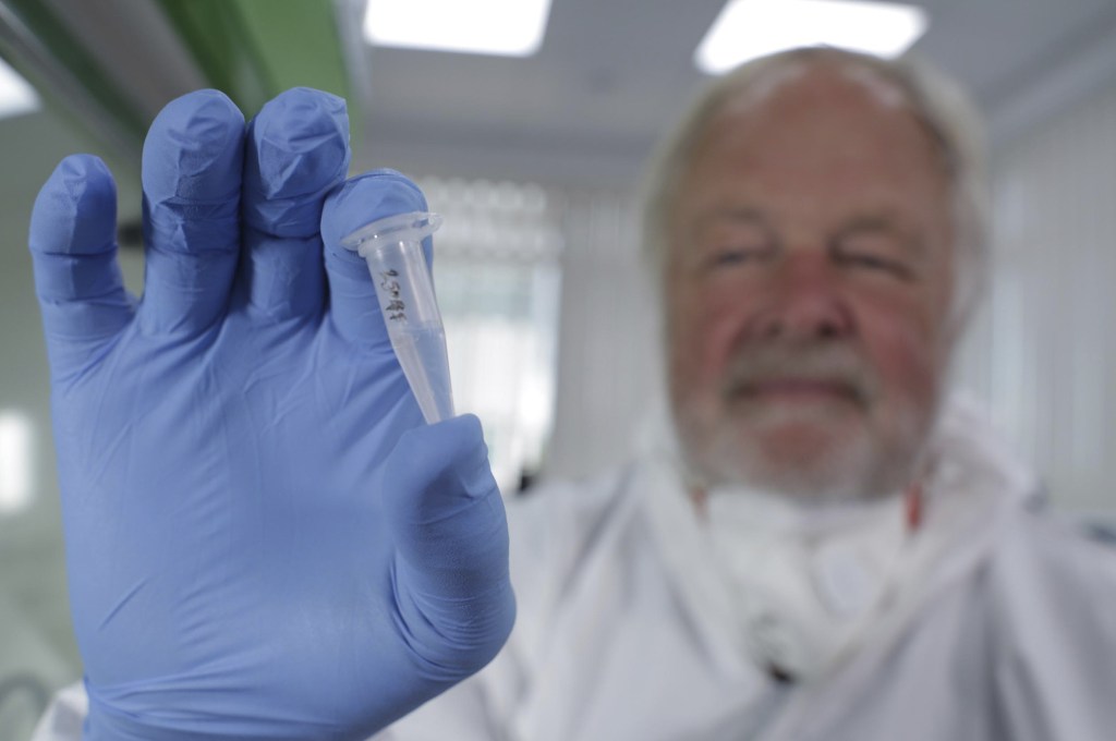 Oxford University genetics professor Bryan Sykes poses with a prepared DNA sample taken from hair from a Himalayan animal. His findings, yet to be published, will be aired in a TV show in the UK Sunday.
