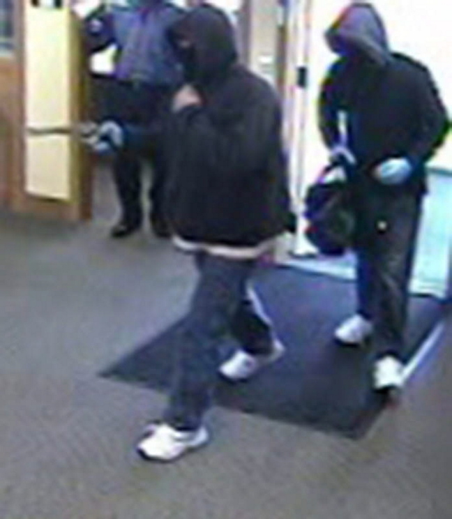 A bank surveillance camera shows the men who robbed a Kennebunk Savings Bank branch in Eliot on Saturday morning.