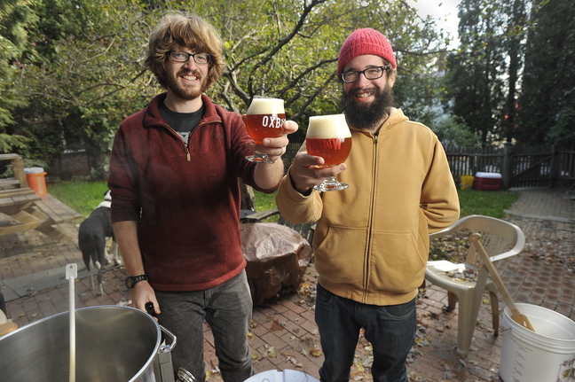 Craig Dilger, who has been brewing beer at home for the past nine years, will be on the upcoming Portland Brew Week’s tour of home brewers. Dilger, left, with help from his friend Bill Boguski, generally brews up several batches of beer each month at his Portland apartment.