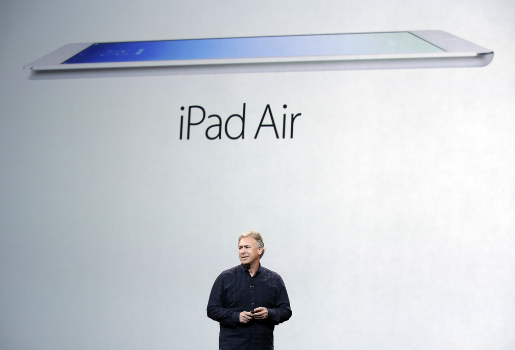 Phil Schiller, Apple’s senior vice president of worldwide product marketing, introduces the new iPad Air on Tuesday in San Francisco. Facing an eroding tablet market and growing competition, Apple is slashing prices this holiday season.
