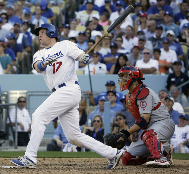 Los Angeles Dodgers’ A.J. Ellis hits a home run during the seventh inning of Game 5 of the National League baseball championship series against the St. Louis Cardinals on Wednesday in Los Angeles.