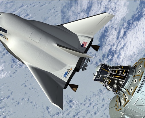 This artist’s rendering shows the proposed Dream Chaser spacecraft – made by Sierra Nevada Space Systems – in a simulated docking with the International Space Station.