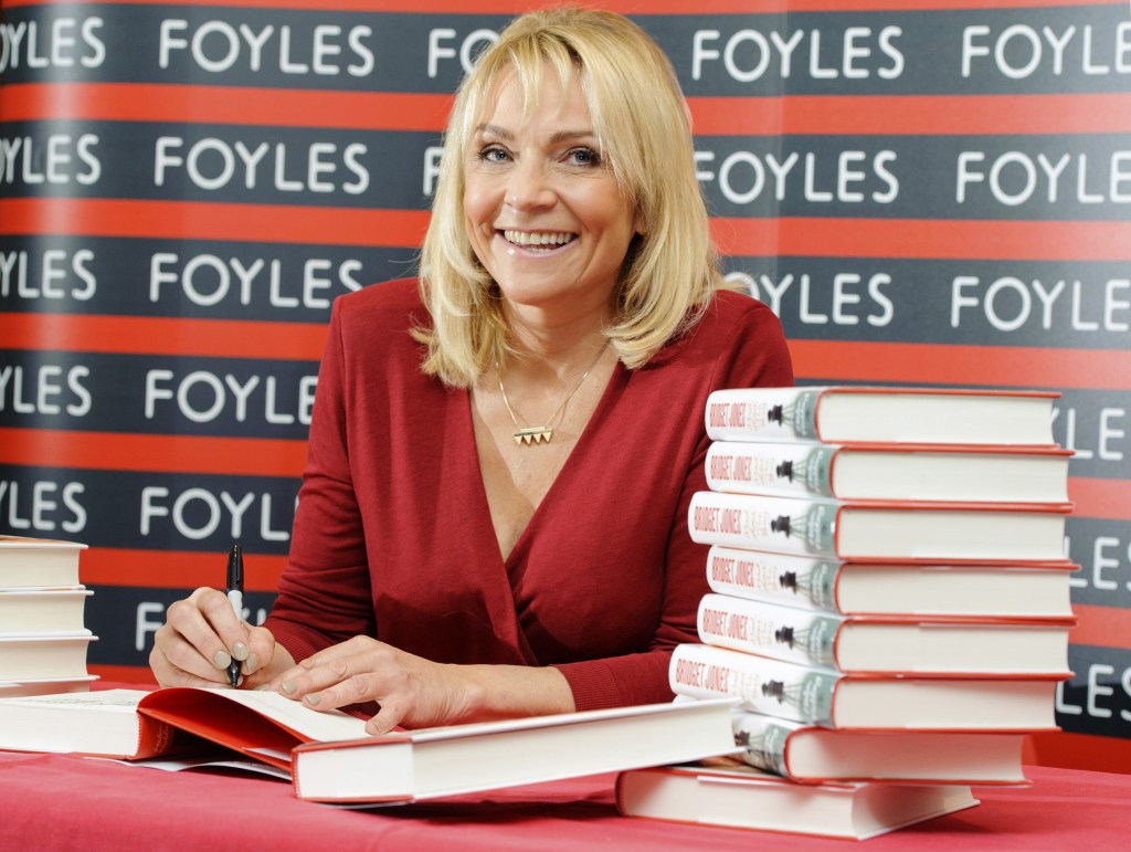 British author Helen Fielding signs copies of her new book “Bridget Jones: Mad About The Boy,” at a bookshop in central London.