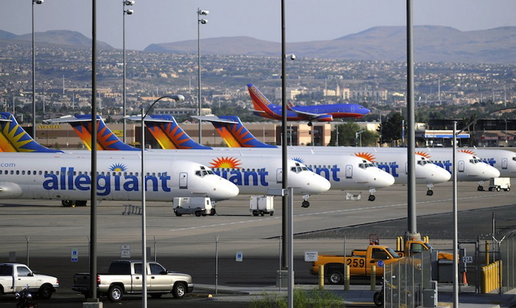 In this May 2013, file photo, Allegiant Air jets are parked at McCarran International Airport in Las Vegas. Allegiant Air is switching its first New Hampshire flight from Portsmouth to Manchester, saying the federal government shutdown delayed the installation of passenger-screening equipment at Portsmouth International Airport at Pease.