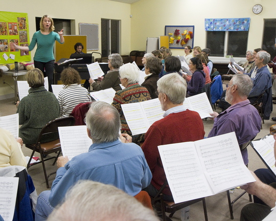Emily Isaacson, the new director of the Oratorio Chorale, leads the chorus in rehearsal, top and above, at the Mid-Coast Presbyterian Church in Topsham.