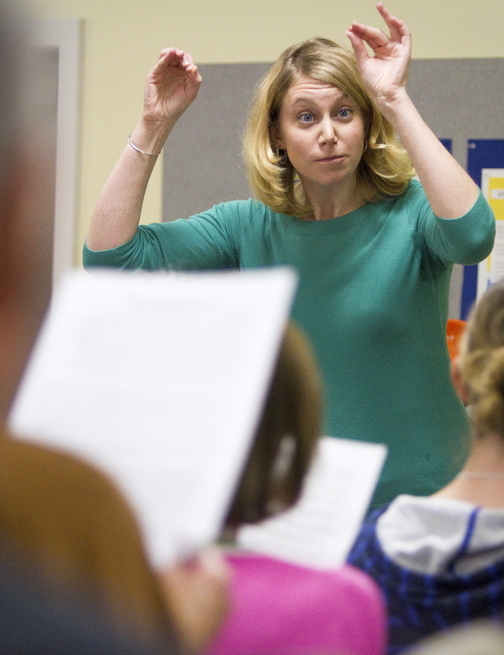 Emily Isaacson, the new director of the Oratorio Chorale, directs the chorus furing practice at the Mid-Coast Presbyterian Church in Topsham.