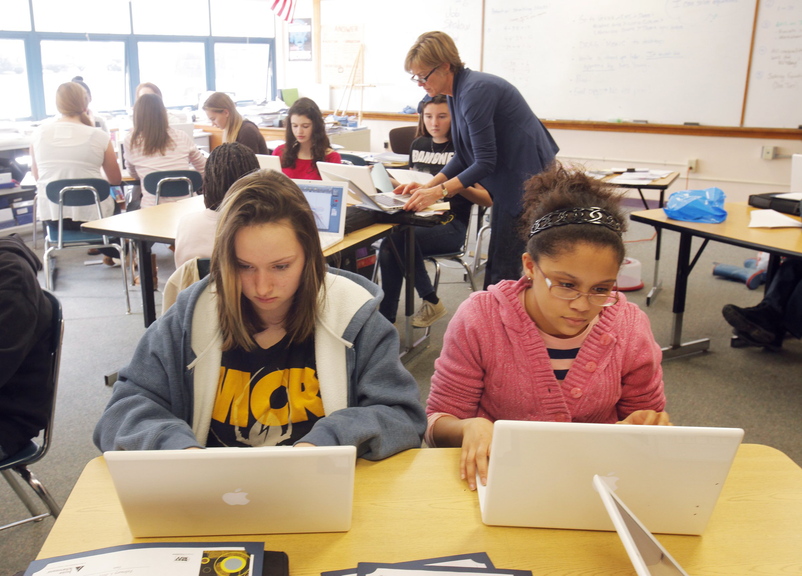 Jessy Brewer, left, and Kiara Neal work on their laptops in Ann Young’s math class at King Middle School in this Feb. 3, 2012, photo.