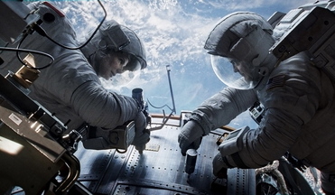 Sandra Bullock, left and below, as Dr. Ryan Stone and George Clooney as Matt Kowalsky in “Gravity.”