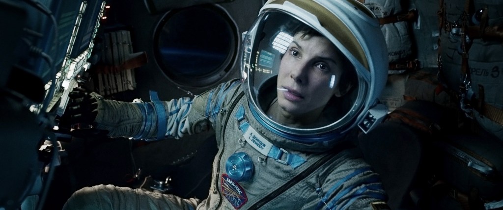 This film image released by Warner Bros. Pictures shows Sandra Bullock in a scene from "Gravity." Bullock says making the lost-in-space movie directed by Alfonso Cuaron was her “best life decision” ever. (AP Photo/Warner Bros. Pictures)