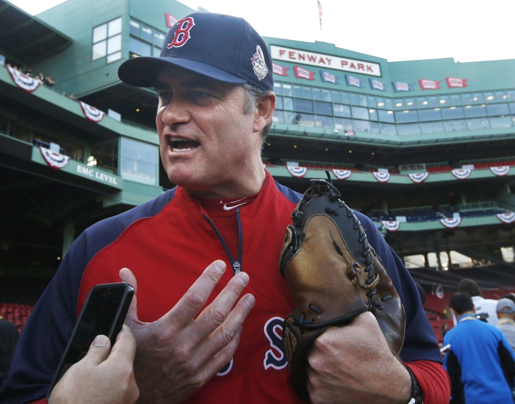 Sox Manager John Farrell speaks to a reporter during World Series practice Monday at Fenway Park. Farrell has not disclosed his lineup for the series, which begins Wednesday.