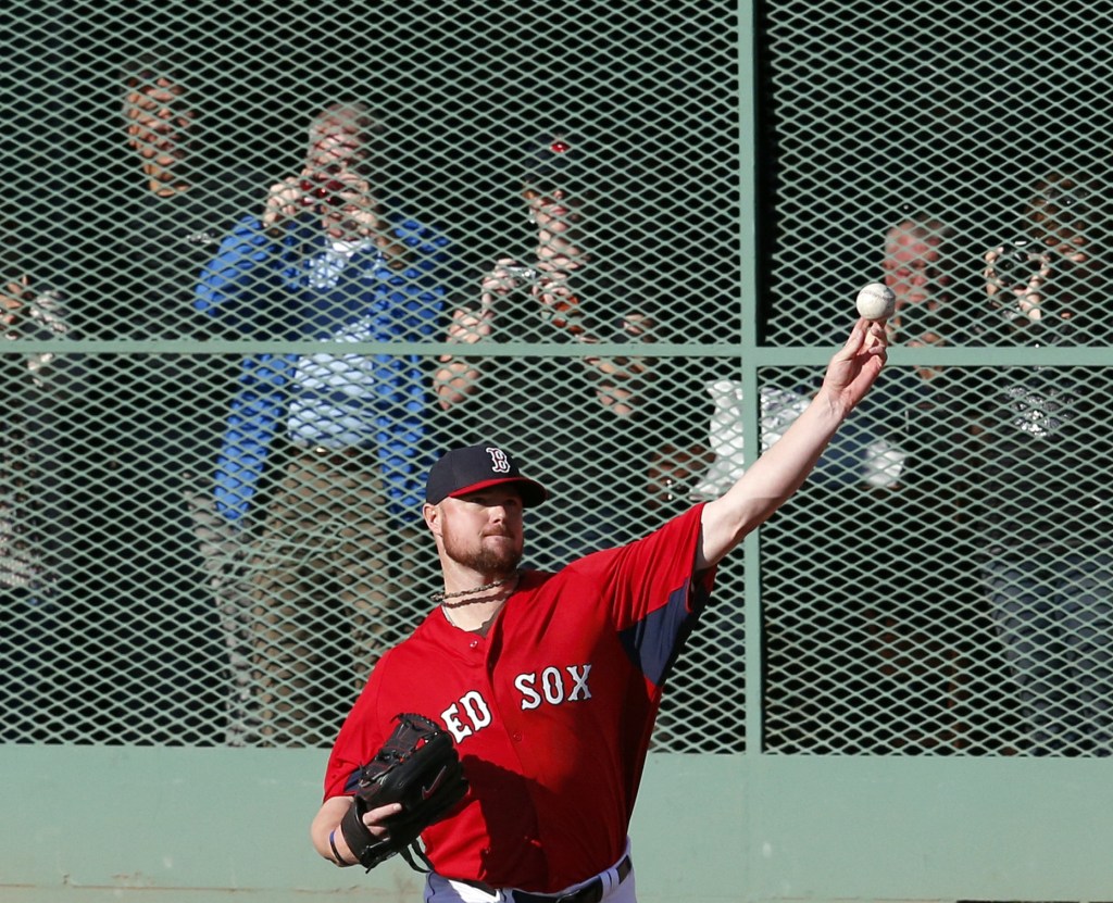 Jon Lester throws during practice on Monday at Fenway Park. Lester will start Game 1 of the World Series for the Red Sox against the Cardinals on Wednesday night.