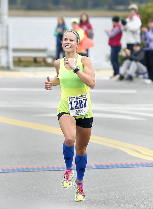 Maine half-marathon winner Sarah Mulcahy, 28, of Baring Plantation approaches the finish line Sunday in Portland.