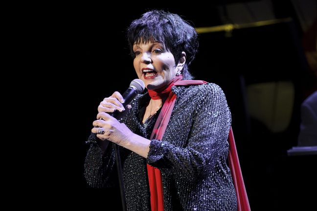 FILE - In this March 1, 2013 file photo, U.S singer Liza Minnelli performs at the Royal Festival Hall in London. A spokesman for the 67-year-old entertainer said she performed with a broken wrist at a benefit concert Monday night, Oct. 14, 2013, in New York. Minnelli broke her wrist in three places while rehearsing at home Sunday night. (Photo by Jonathan Short/Invision/AP, file)