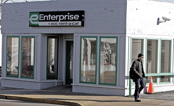An Enterprise Rent-A-Car storefront is shown in Maplewood, Mo. The company plans to hire 11,000 new workers by August.