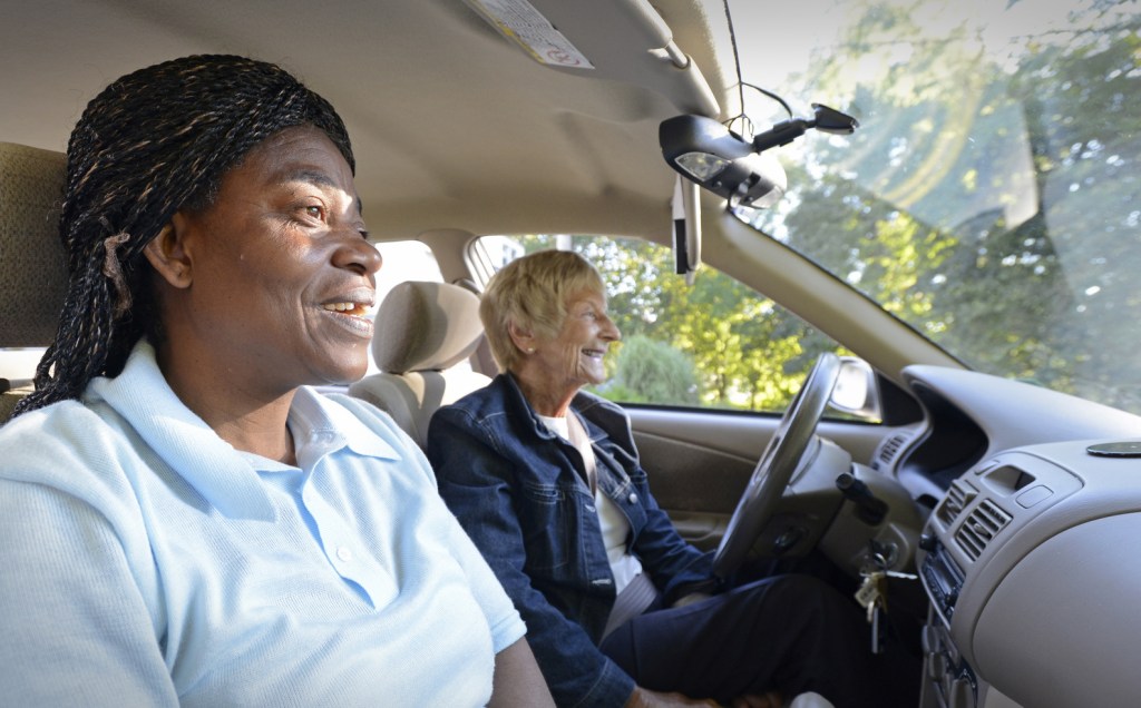 Ann Lilljedahl of Cape Elizabeth drives Portland resident Valerie Kibala from a South Portland bus stop to where she works in Cape Elizabeth. Kibala's long daily commute includes two buses each way to and from her home in Portland. Lilljedahl is one of three volunteer drivers to help Kibala.