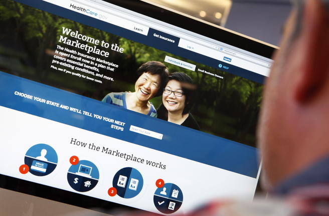 A man reviews the Affordable Care Act signup page on the HealthCare.gov site in this photo illustration. Requiring every citizen to help defray the cost of health care by buying insurance is a way to spread out the cost of a service we all use.