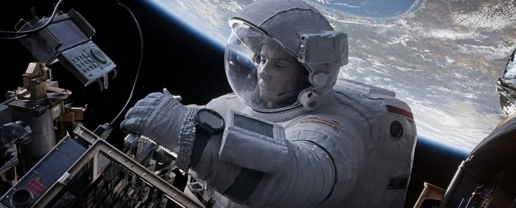 Sandra Bullock takes a spacewalk in this still image of a scene in the movie “Gravity.”