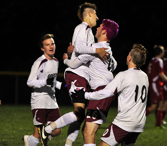 Miles Shields celebrates with his Greely High teammates Wednesday night after scoring the second goal of the game in a 3-0 victory over Gray-New Gloucester in a Western Class B boys’ soccer quarterfinal at Cumberland.