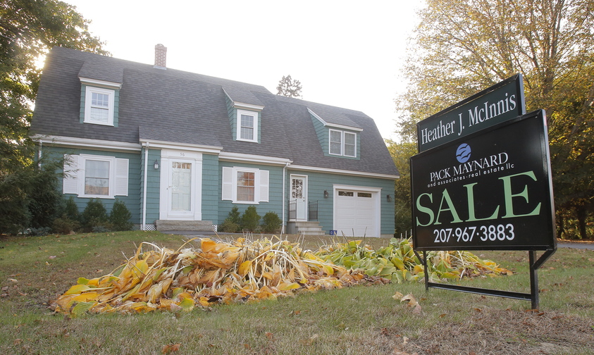 A for sale sign is posted in front of a home on Fletcher Street in Kennebunk. Maine home sales jumped 24.59 percent in September 2013 over September 2012, doubling the pace seen nationally.