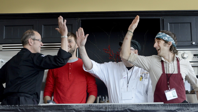 Chef Kerry Altiero, left, from Cafe Miranda in Rockland, gets high-fives after winning the Top of the Crop: Maine’s Best Farm to Table Restaurant competition at Ocean Gateway in Portland on Friday. Joining Altiero in the competition were chefs Chad Conley, Rich Hanson and David Levi.
