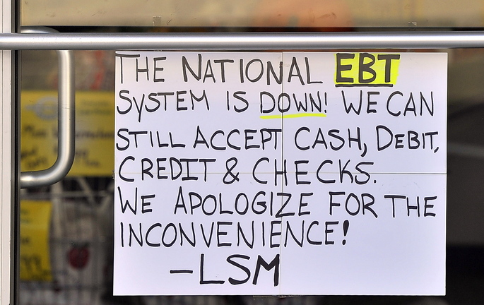 Owners of Smaha's Legion Square Market in South Portland's Knightville put a sign on their door Saturday warning customers who use food stamp cards that they were unable to process card transactions. The problems, which occurred in 17 states where the program is operated by Xerox, was blamed on a computer glitch that was corrected later in the day.