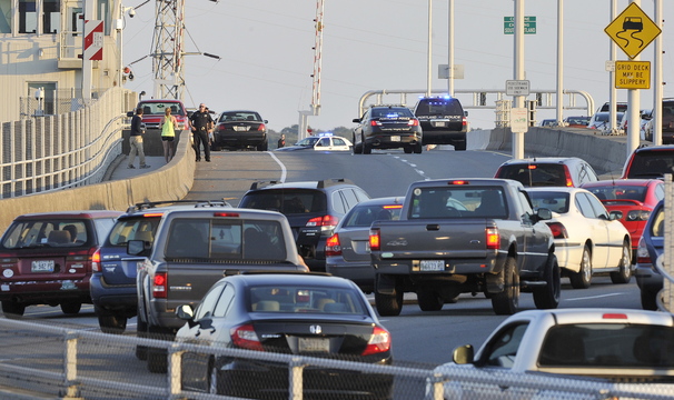 John Ewing/Staff Photographer Police respond to reports of a person threatening to jump from the Casco Bay Bridge on Wednesday evening, Oct. 2, 2013. Traffic was allowed to cross the bridge toward South Portland, but was blocked in the Portland lanes at the height of rush hour.