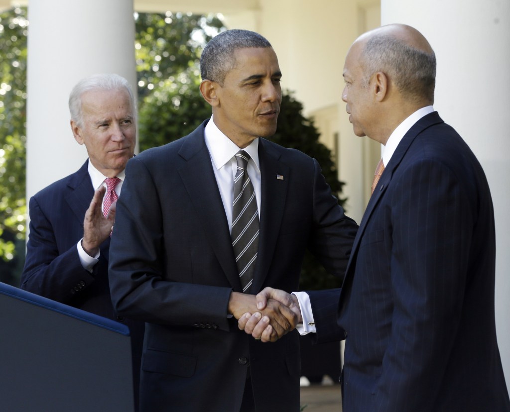 President Barack Obama, center, shakes hands with with Jeh Johnson, right, his choice for the next Homeland Security Secretary, as Vice President Joe Biden, left, applauds in the Rose Garden at the White House in Washington, Friday, Oct. 18, 2013. Johnson was general counsel at the Defense Department during the wars in Iraq and Afghanistan.