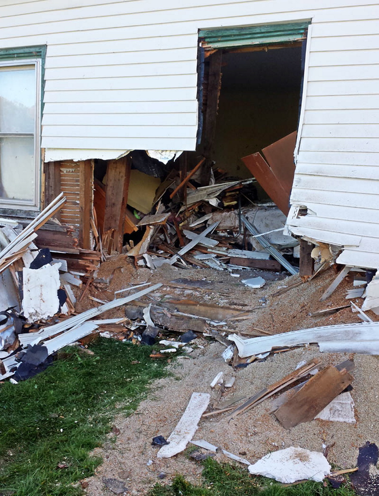 An Oldsmobile crashed through a wall into this home on Knowles Road in Belgrade on Thursday night.
