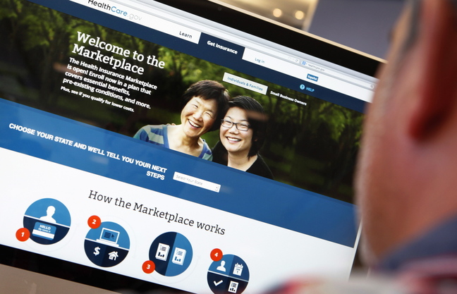 A man looks over the Affordable Care Act signup page on the www.healthcare.gov website in this photo illustration. The federal government’s portal logged over 2.8 million visitors by the afternoon of Oct. 2, a day after Obamacare was launched.
