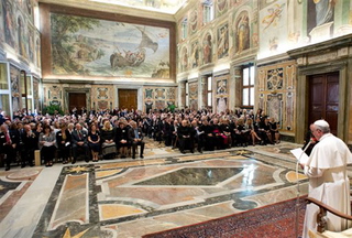Pope Francis delivers a message to the Patrons of the Arts of the Vatican Museum on Oct. 19. The Patrons celebrated their 30th anniversary with a five-day extravaganza, which included lectures on museum restoration projects, individual chats with Pope Francis, catered dinners in museum galleries, and capped by a private audience with Francis who took time to greet each of the nearly 350 patrons and their families.