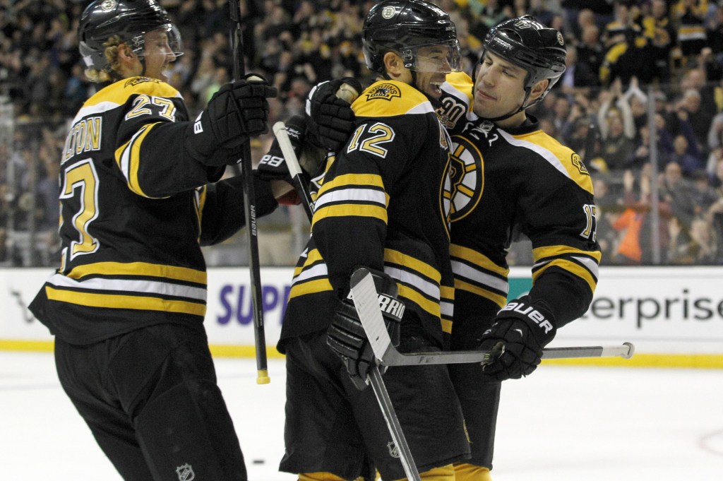 Jarome Iginla, center, is congratulated by Dougie Hamilton, left, and Milan Lucic after scoring in the second period. It was his first goal for the Bruins and provided a 1-0 lead.
