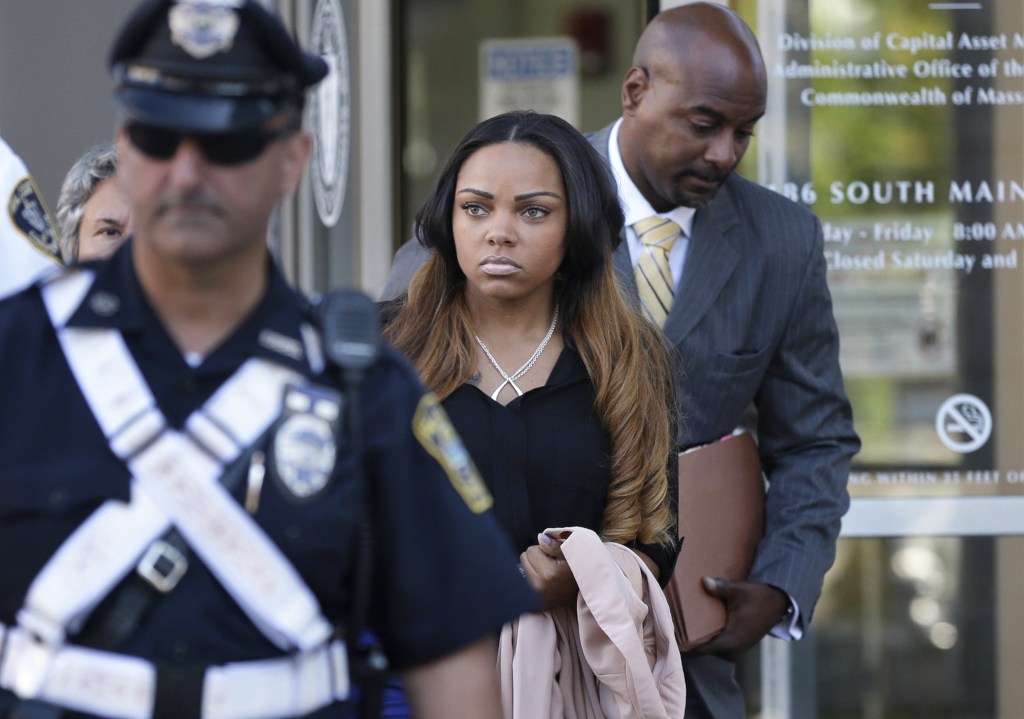 Shayanna Jenkins, girlfriend of former New England Patriot Aaron Hernandez, leaves court Tuesday in Fall River, Mass., after her arraignment on a perjury charge for allegedly lying to a grand jury, including about disposing of evidence in the murder case against Hernandez.