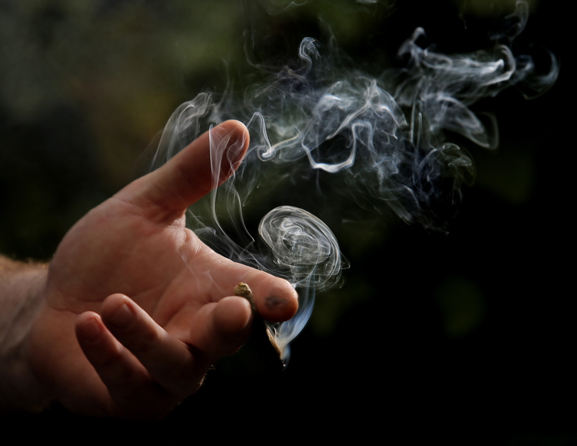 Smoke billows from a marijuana cigarette in Portland last week. On Nov. 5, the city will vote on a citizen-led referendum to enact an ordinance to legalize recreational marijuana for adults over the age of 21. There will still be no legal way for people to obtain marijuana.