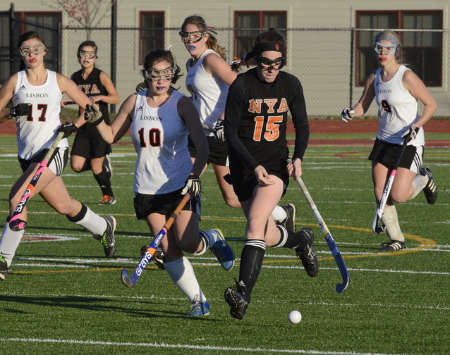 John Patriquin/StaffPhotographer Lisbon’s Jennifer Smith chases the ball with NYA’s Olivia Madore as North Yarmouth Academy and Lisbon play for the Western Class C field hockey championship at Thornton Academy in Saco. NYA won the game, 2-1.
