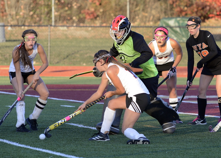 John Patriquin/StaffPhotographer Lisbon’s #13 Hannah Jordan tries to score against NYA’s goalkeeper Elizabeth Coughlin as North Yarmouth Academy and Lisbon play for the Western Class C field hockey championship at Thornton Academy in Sacoon Wednesday. NYA won the game, 2-1.