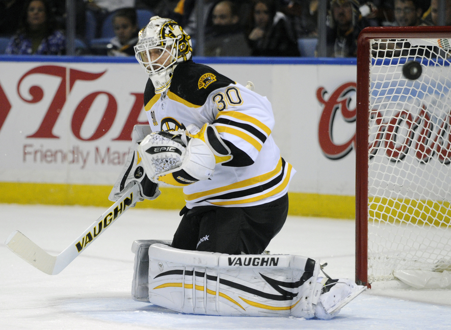 Bruins goaltender Chad Johnson deflects the puck wide of the goal in Wednesday’s game against the Sabres at Buffalo, N.Y. The Bruins won, 5-2.