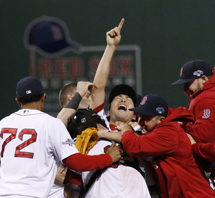 Red Sox closer Koji Uehara, center, celebrates with teammates after a 5-2 win Saturday over the Detroit Tigers clinched the American League Championship Series.