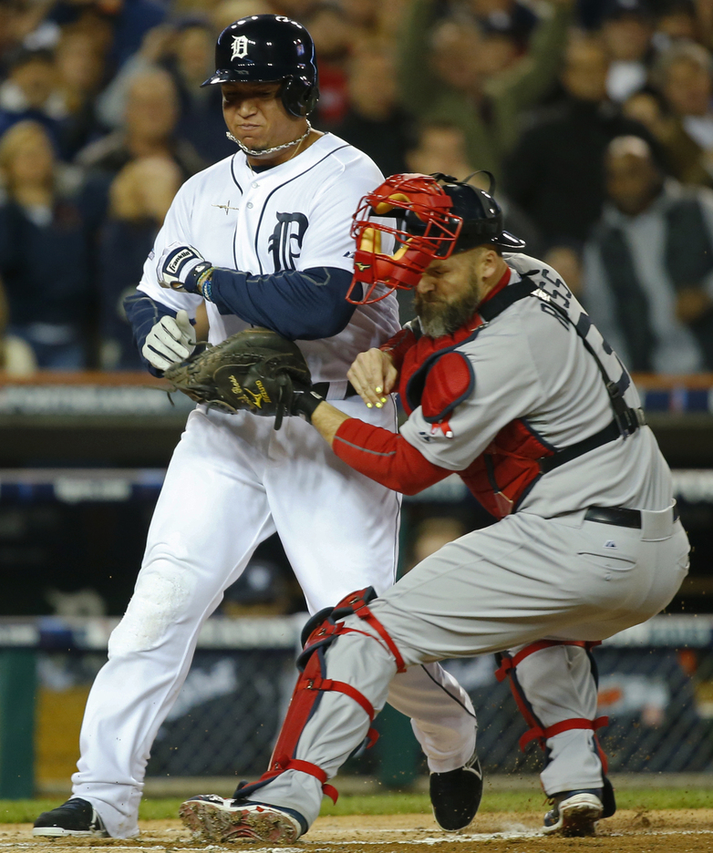 Miguel Cabrera of the Detroit Tigers is tagged out at home by Boston catcher David Ross in the first inning of Game 5. The Red Sox moved into a 3-2 series lead.