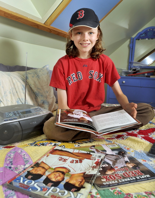 Finn Dierks-Brown, 12, says the Red Sox don’t lose when he listens to WEEI broadcasts, and hopes the team won’t be jinxed by ESPN Radio coverage of the World Series.