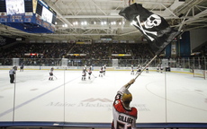In this 2010 file photo, Dan Bailey of Yarmouth waves the Jolly Roger during a game between the Portland Pirates and Manchester Monarchs at the Cumberland County Civic Center. The Maine Hockey Group has taken an option on a piece of city-owned land in Saco as a possible site for an arena for the Portland Pirates, but that doesn’t necessarily mean the American Hockey League team will be moving to York County.