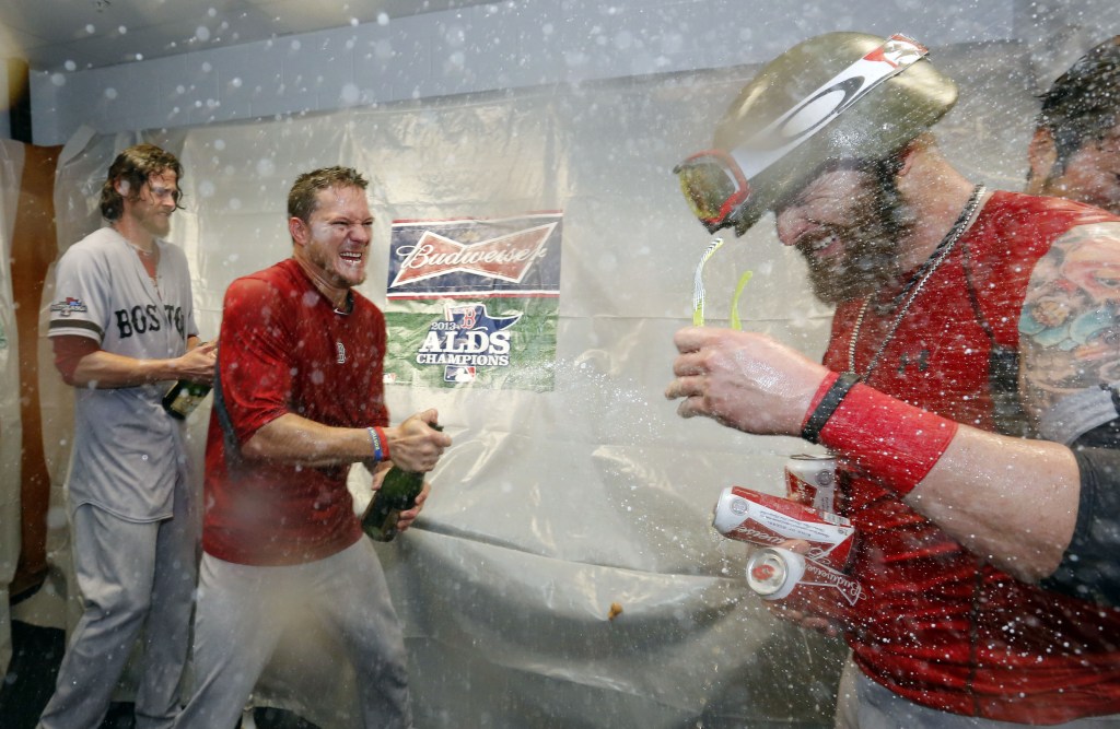 Boston Red Sox’s players celebrate their victory over the Tampa Bay Rays in Game 4 of an American League baseball division series, Wednesday, Oct. 9, 2013, in St. Petersburg, Fla. The Boston Red Sox’s defeated the Tampa Bay Rays 3-1 to move on to the American League Championship Series.