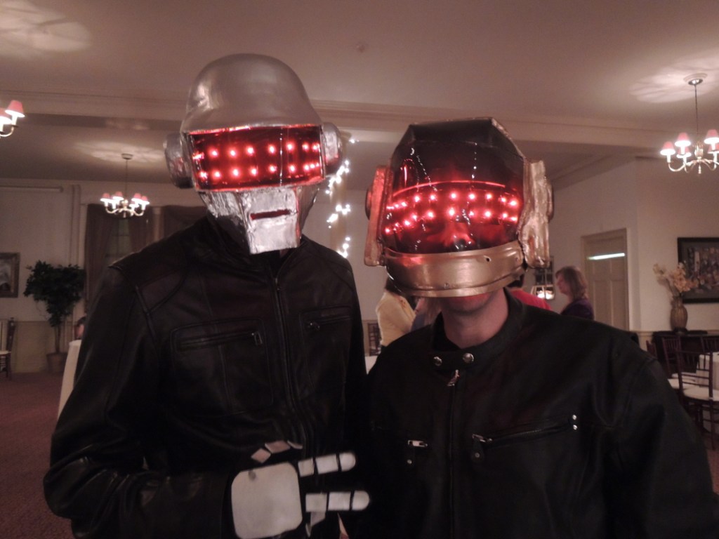 Chad Cote, of Windham, and Ellis Baum, of Saco, lit up the room as techno band Daft Punk, representing event sponsor Clark Insurance.
