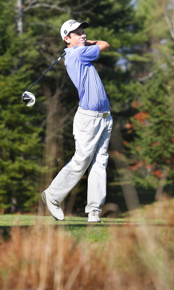 Chris Billings of Cheverus watches a tee shot during the high school individual state golf championships Saturday. Billings tied for first place in Class A with a 75.