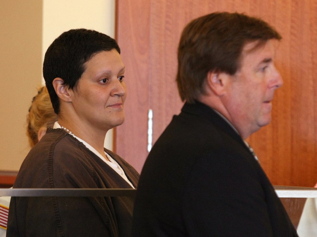 Tanya Singleton, left, and her attorney Peter Parker, appear in Fall River Superior Court on Sept. 30, 2013. Singleton, a cousin of former New England Patriots tight end Aaron Hernandez pleaded not guilty to a conspiracy charge for her alleged actions following the killing of Hernandez’s friend.