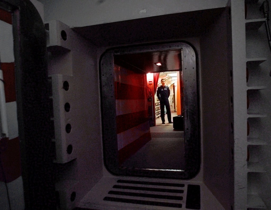 An Air Force missile crew commander stands at the door of his launch capsule 100 feet underground where he and his partner are responsible for 10 nuclear-armed ICBM’s, in north-central Colorado.